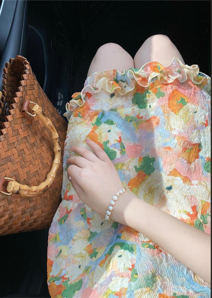 Robe mi-longue à volants et imprimés à la mode sans manches UU1009