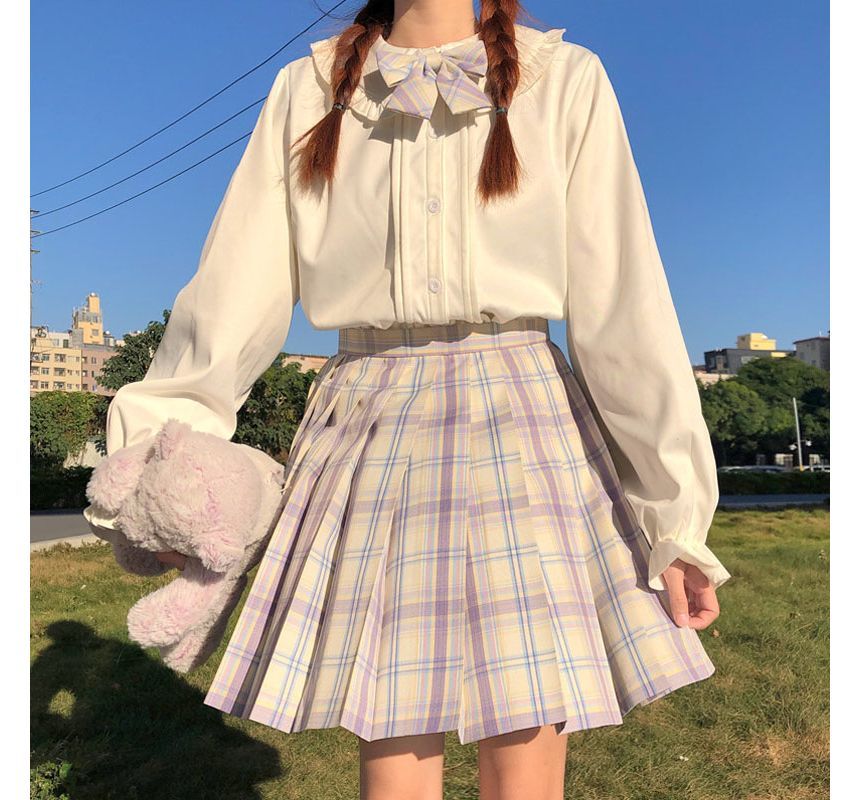 Chemisier à manches longues et bordure à volants