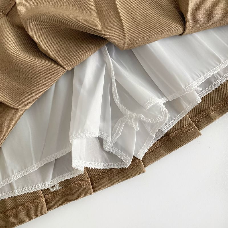 Jupe trapèze mini plissée unie taille haute