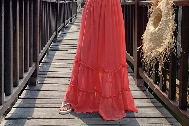 Robe longue à volants et découpes unies