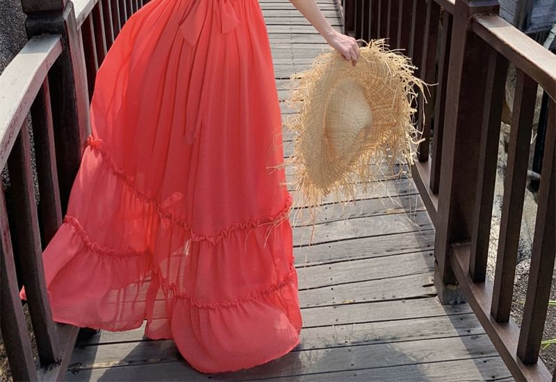 Robe longue à volants et découpes unies