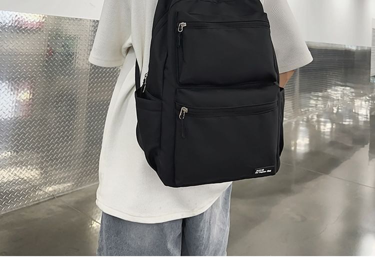 Multi-Pocket Backpack Applique