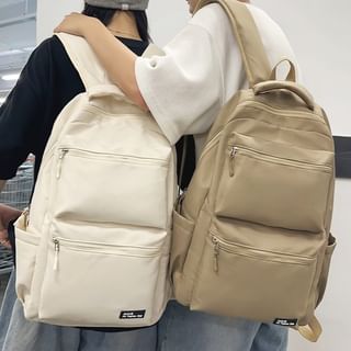 Sac à dos multi-poches avec appliques