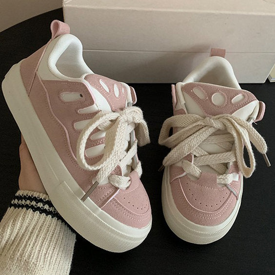 Süße rosa Turnschuhe