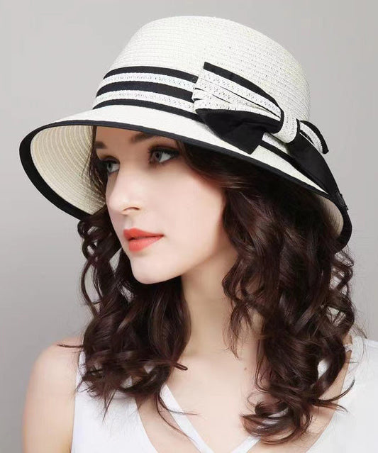 Chapeau de soleil tissé en paille de plage polyvalent et pliable avec nœud blanc II049