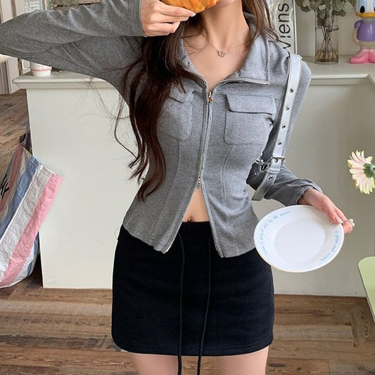 Haut slim uni à manches longues et col zippé