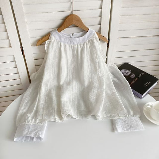 Chemisier uni à volants et épaules dénudées