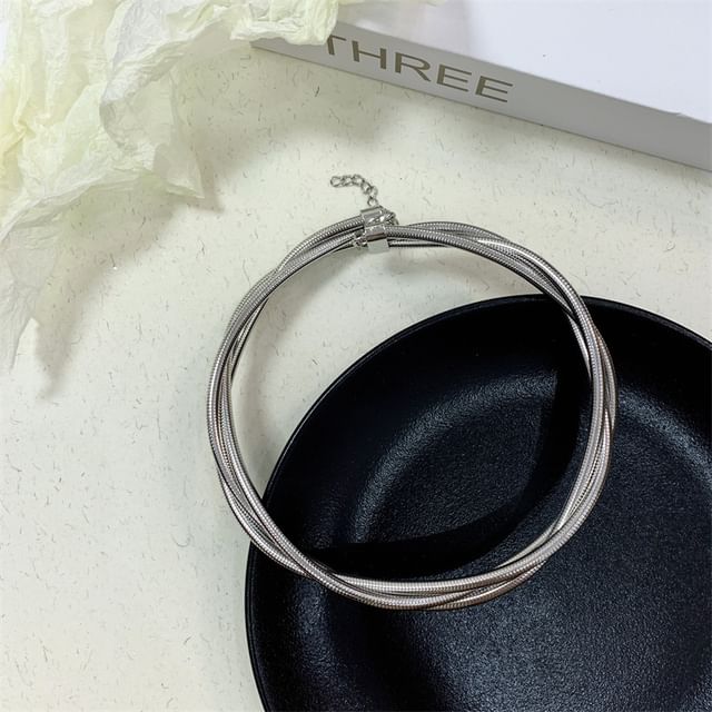 Layered Alloy Choker